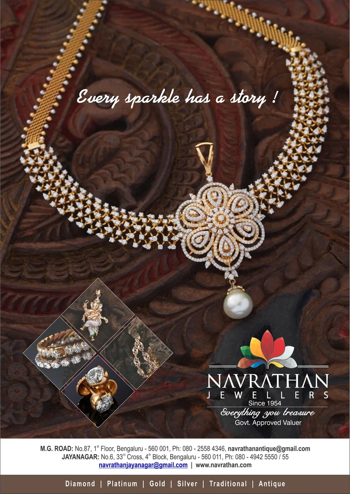 A diamond necklace and pendant arranged on a carved wooden surface